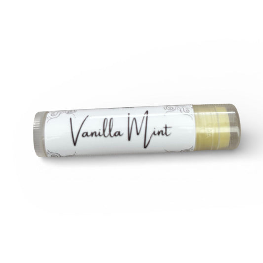 Lip balm stick with 'Vanilla Mint' branding on a textured surface