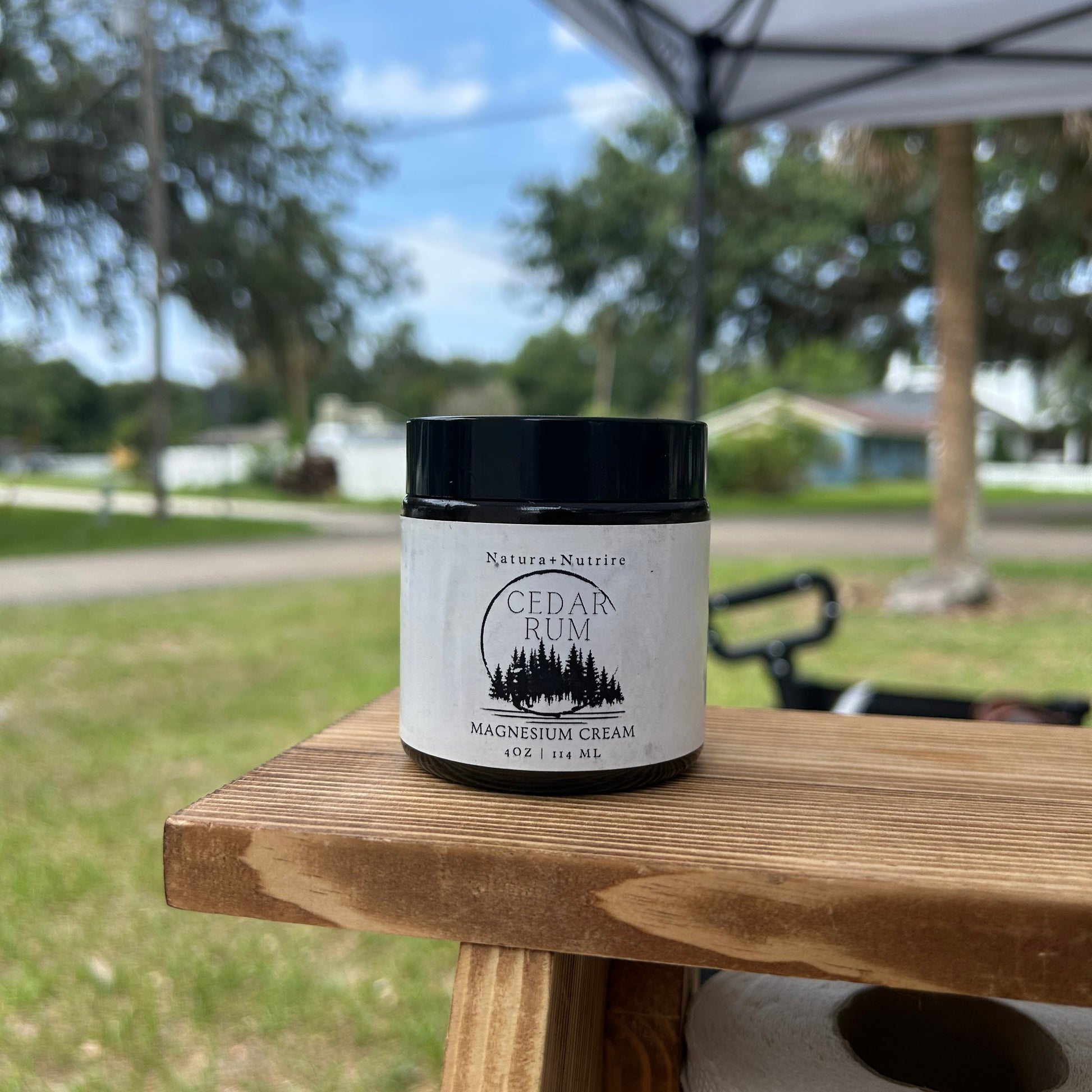 Cera product on a wooden surface with a blurred outdoor background