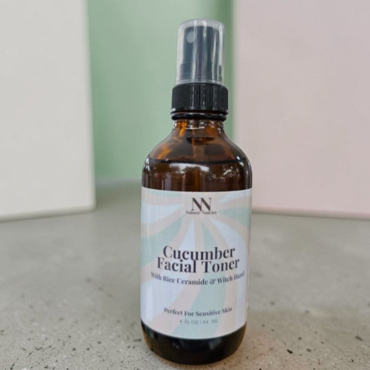 Bottle of cucumber facial toner on a neutral background