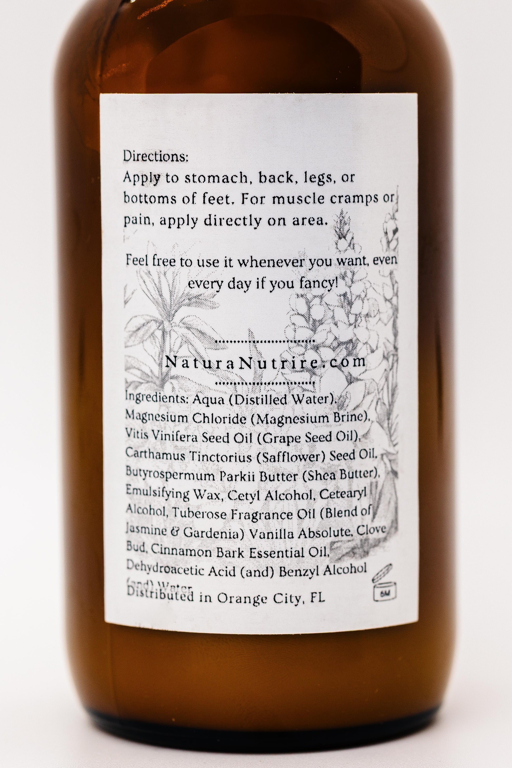 Brown bottle with white label on a white background