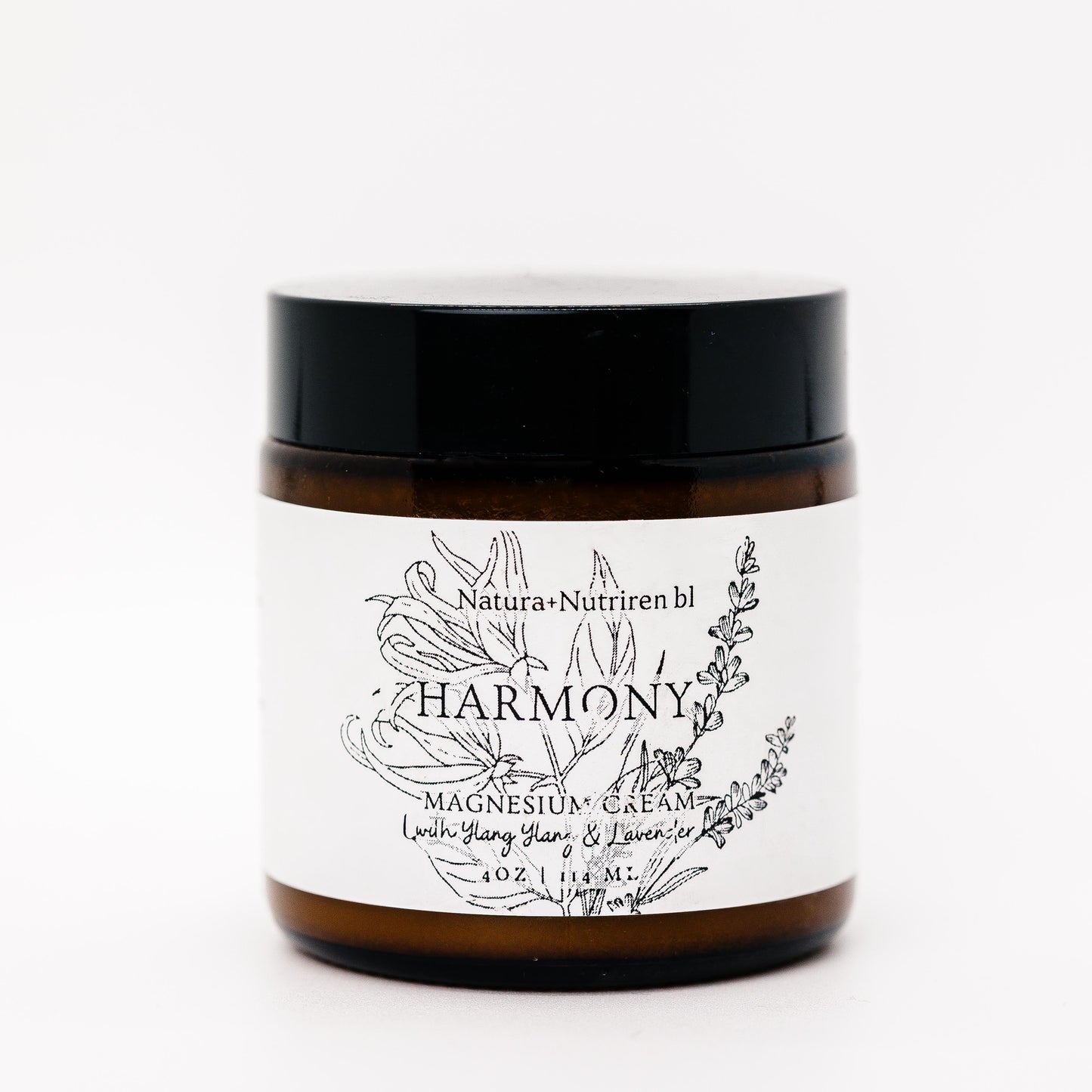 Jar of 'Harmony' magnesium cream with a black lid on a white background
