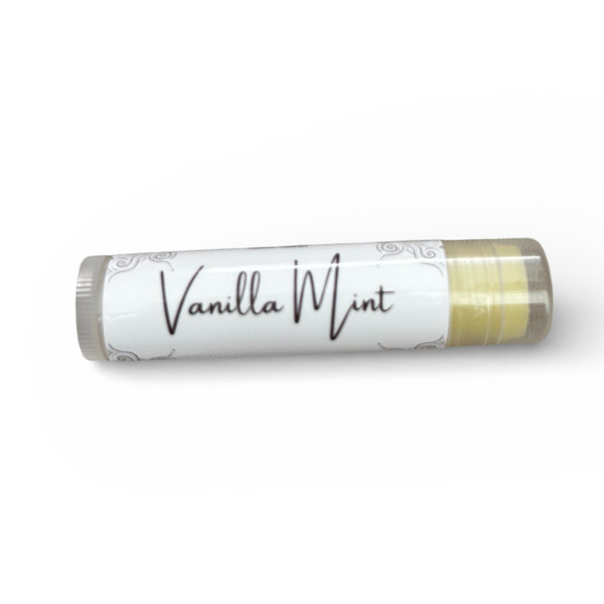 Lip balm stick with 'Vanilla Mint' branding on a textured surface