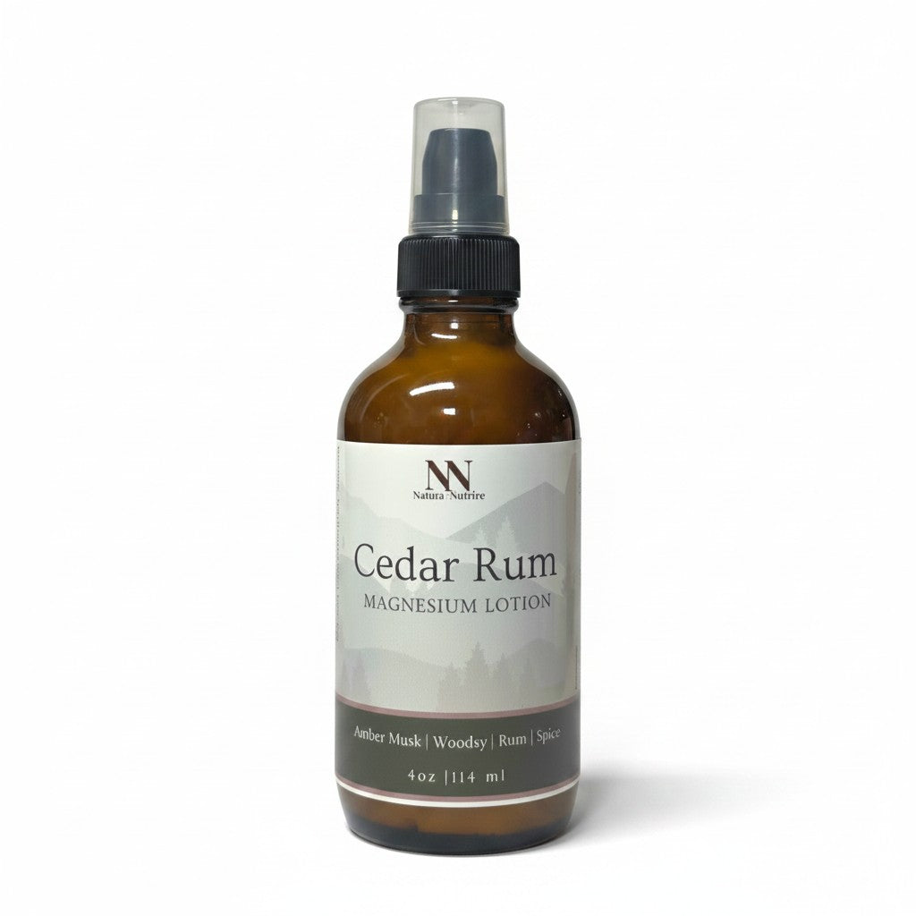Cedar Rum Magnesium Lotion 4oz spray bottle with green and gray mountain-patterned label on a white background