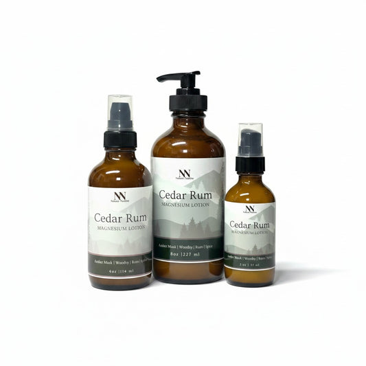 Three Cedar Rum Magnesium Lotion bottles - 8oz pump, 4oz spray, and 2oz spray - on a white background