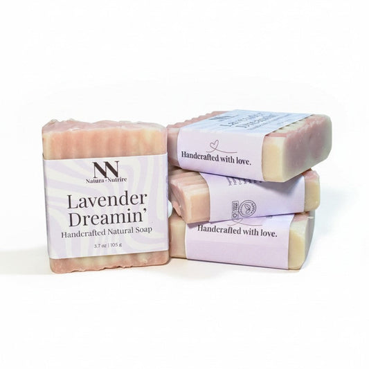 Three bars of lavender soap with 'Lavender Dreamin'' packaging on a white background