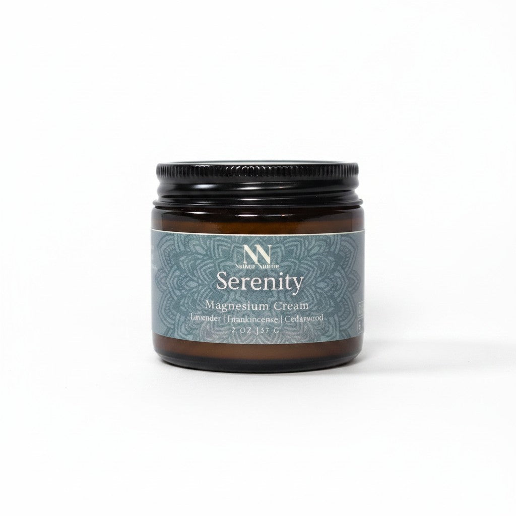 Serenity Magnesium Cream 2oz jar with teal mandala-patterned label on a white background