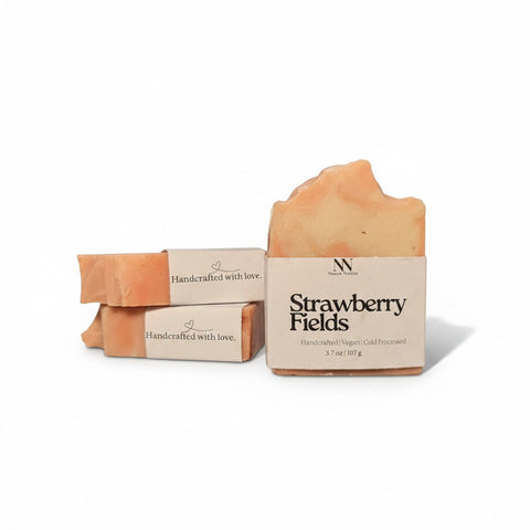 Strawberry Fields Handcrafted Soap bars with kraft paper labels, boxed and unboxed, on a white background