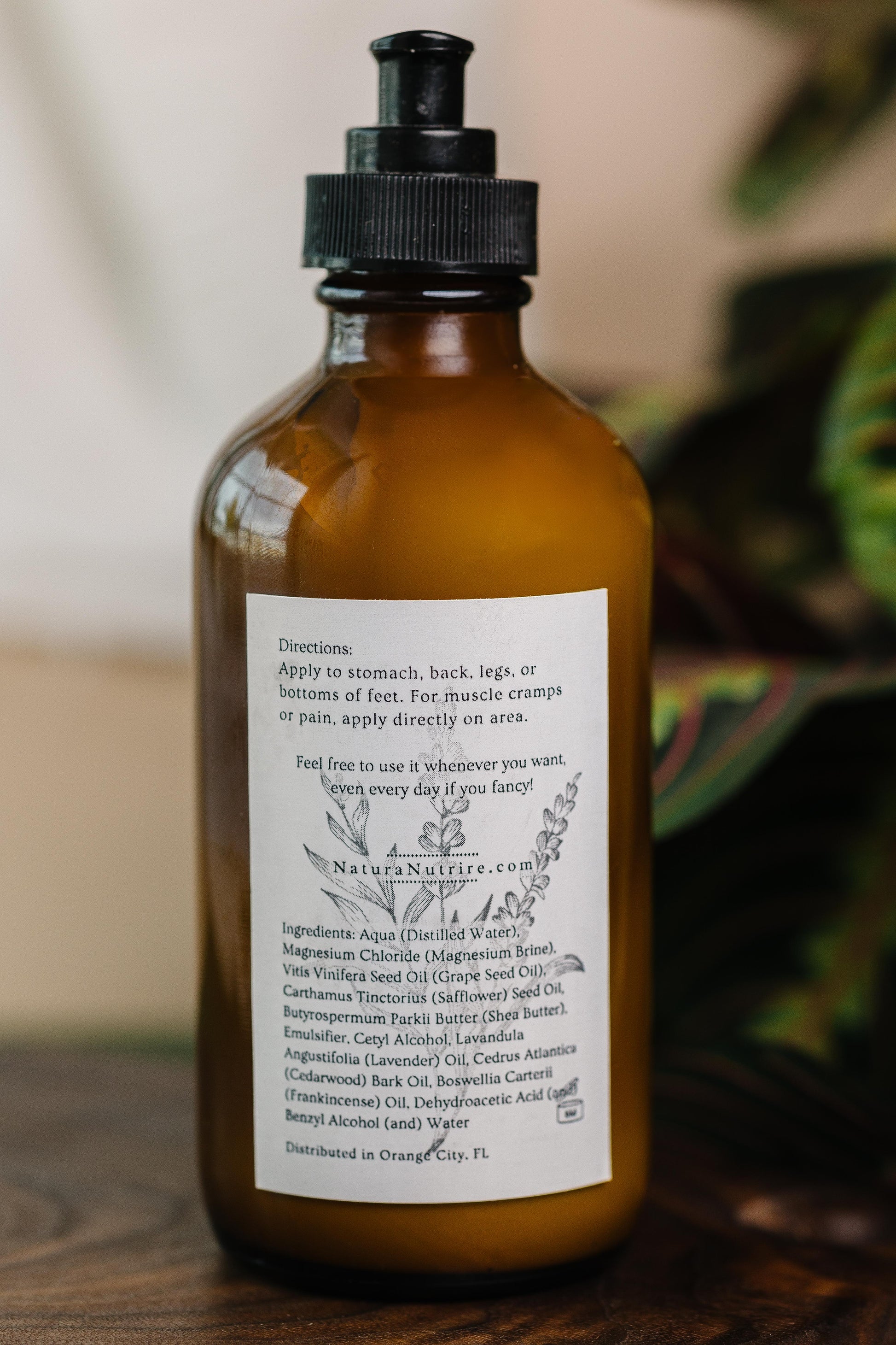 Brown bottle with a label on a wooden surface