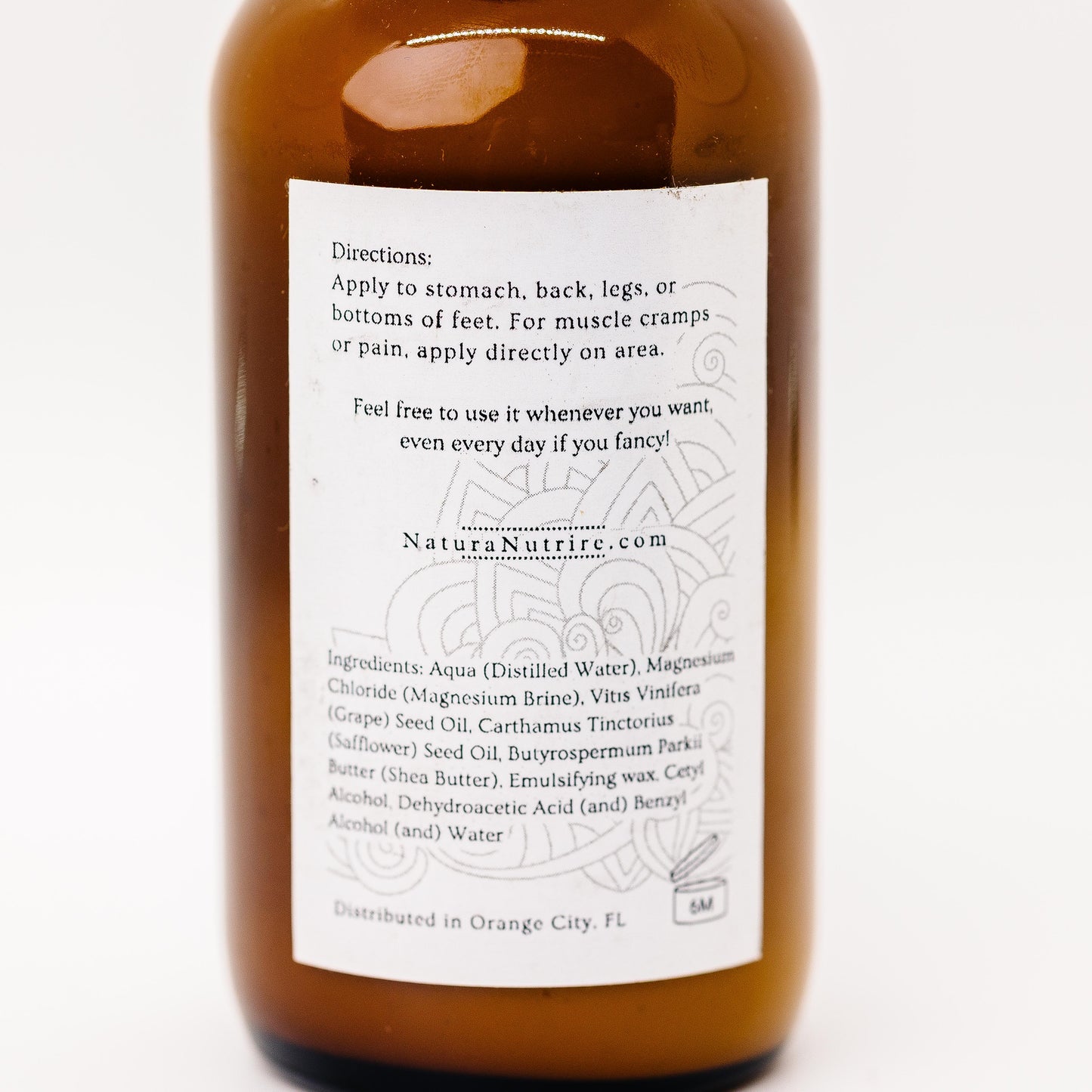 Brown bottle with label on a white background