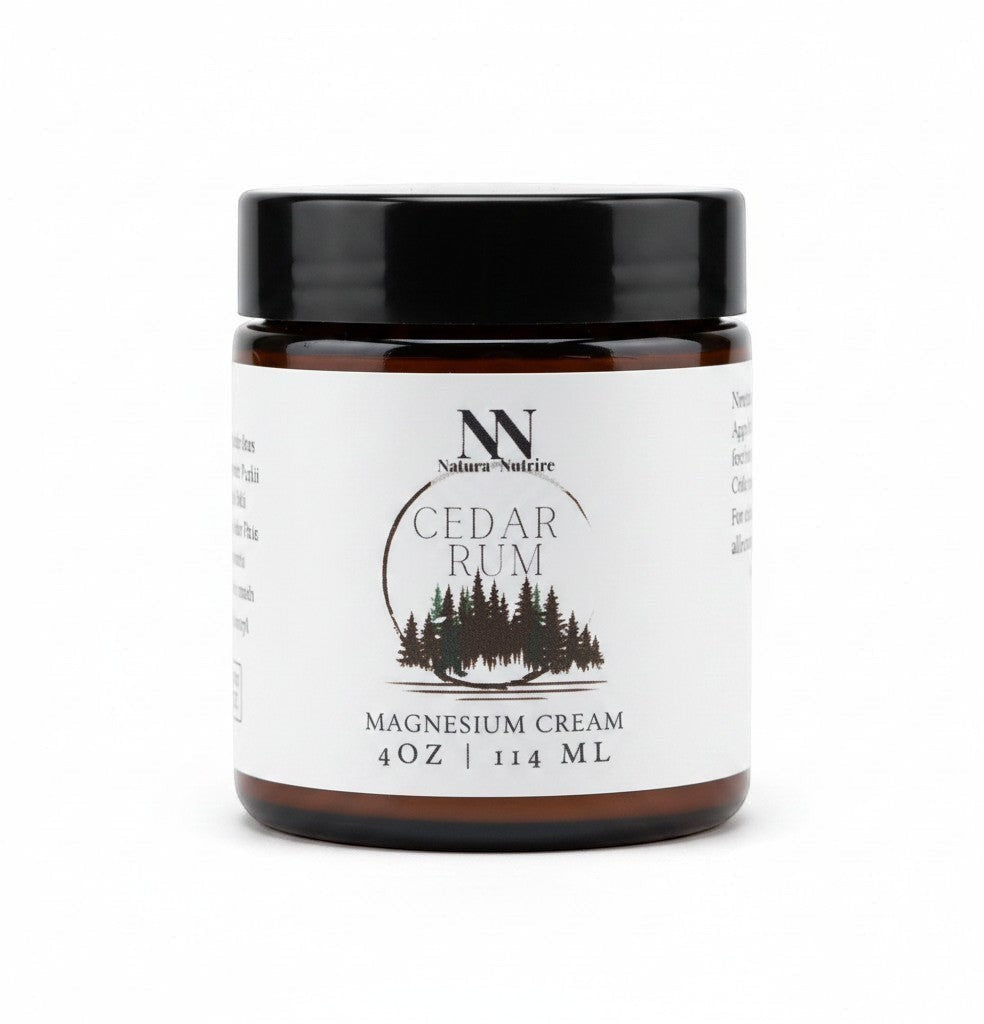 Natura+Nutrire Magnesium Cedar Rum muscle relief cream in a 4oz amber glass jar with a black lid.